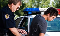 Police officer handcuffing suspect