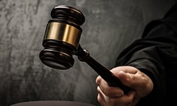 Hand with gavel about to hit