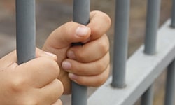 hands behind bars